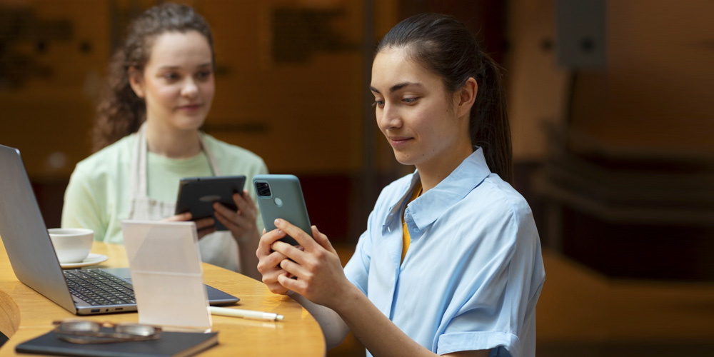 A nurse examines a patient's advanced clinical report on a screen.