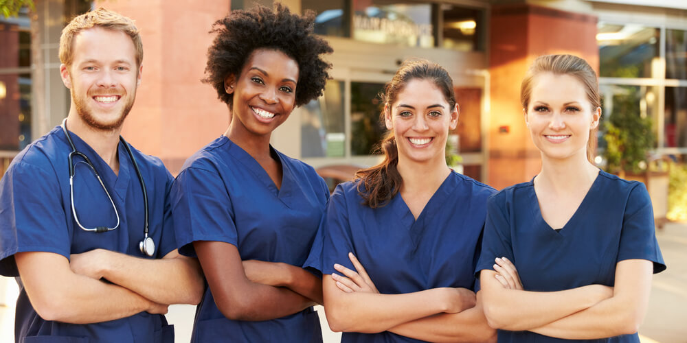 Registered general nurses (RGN) discussing a case in the hospital corridor