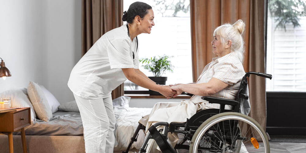 A nurse and an elderly patient read the directions on a medicine bottle.