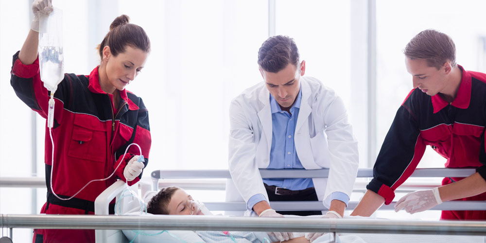 A nurse examines a patient's advanced clinical report on a screen.